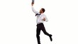 Businessman jumping up holding tablet pc