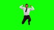 Businessman listening to music while jumping up and cheering