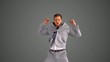 Succesful businessman jumping on grey background