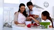 Family preparing pastry together