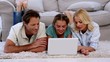 Video: Parents and daughter using laptop on floor Parents and daughter using laptop on floor