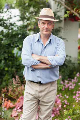 Photo: Man with a hat in the garden Man with a hat in the garden