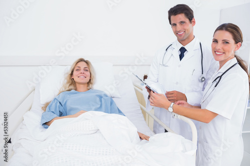 Photo: Smiling patient and doctors Smiling patient and doctors