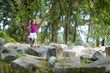 A girl sightseeing historical ruins of Asclepieion