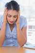 Photo: Unhappy businesswoman having her head in hands Unhappy businesswoman having her head in hands