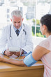 Doctor measuring the heartbeat of a patient