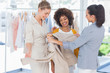 Fashion designers looking at a blazer