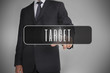 Businessman selecting label with target written on it