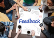 Feedback written on a poster with drawings of charts