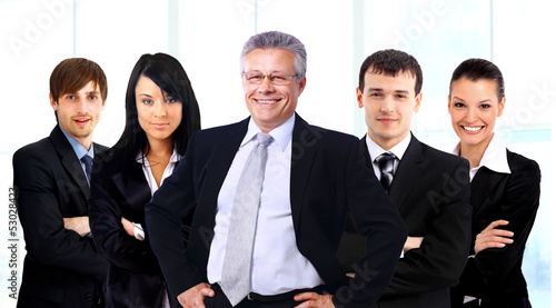 Photo: business man and his team isolated over a white background business man and his team isolated over a white background