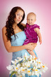 portrait of young beautiful mother and her baby daughter