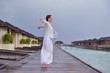 Photo: young woman relax on cloudy summer day young woman relax on cloudy summer day