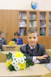 The first-grader sit in classroom