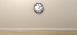 Photo: Antique Clock Hanging In Empty Room Antique Clock Hanging In Empty Room