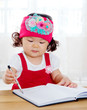 Little asian girl writing