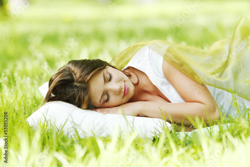 Photo: Woman sleeping on grass Woman sleeping on grass