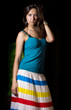 Beautiful girl in a striped skirt