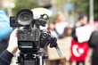 Photo: covering a street protest using video camera covering a street protest using video camera