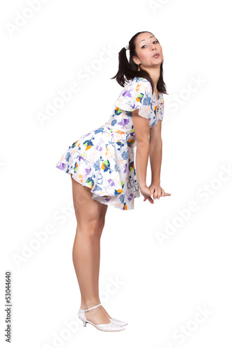Photo: A girl with pigtails in colorful retro dress A girl with pigtails in colorful retro dress