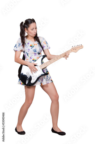 Photo: A girl with pigtails in colorful retro dress A girl with pigtails in colorful retro dress