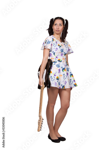 Photo: A girl with pigtails in colorful retro dress A girl with pigtails in colorful retro dress