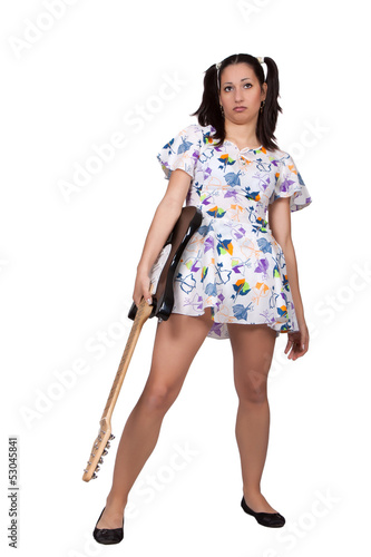 Photo: A girl with pigtails in colorful retro dress A girl with pigtails in colorful retro dress