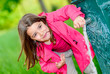 cute kid about to drink water in a fountain