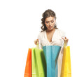 Foto: A young woman holding shopping bags isolated on white A young woman holding shopping bags isolated on white