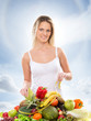 Foto: Young attractive girl with a pile of fruits and vegetables isola Young attractive girl with a pile of fruits and vegetables isola
