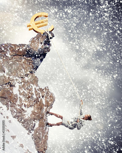 Photo: businesswoman climbing mountain businesswoman climbing mountain