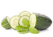 Sliced cucumber vegetable and basil leaves still life