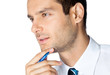 Portrait of thinking businessman, on white