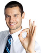 Photo: Businessman with okay gesture, isolated Businessman with okay gesture, isolated