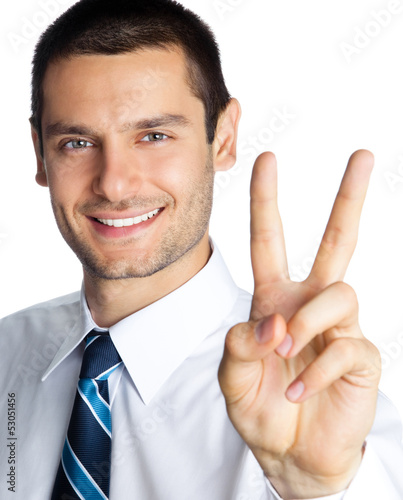 Photo: Happy businessman showing two fingers, isolated Happy businessman showing two fingers, isolated