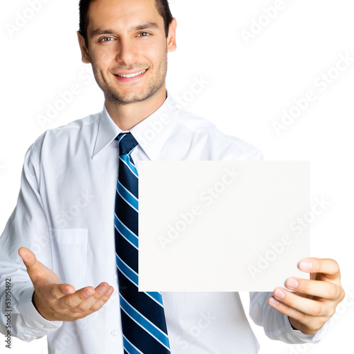 Photo: Happy businessman showing signboard, isolated Happy businessman showing signboard, isolated