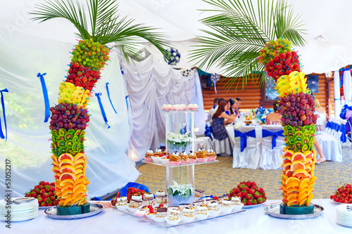 Photo: colorful fruit and cake decoration on banquet party colorful fruit and cake decoration on banquet party