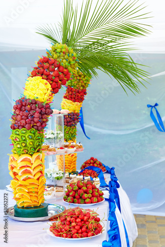 Photo: colorful fruit and cake decoration on banquet party colorful fruit and cake decoration on banquet party