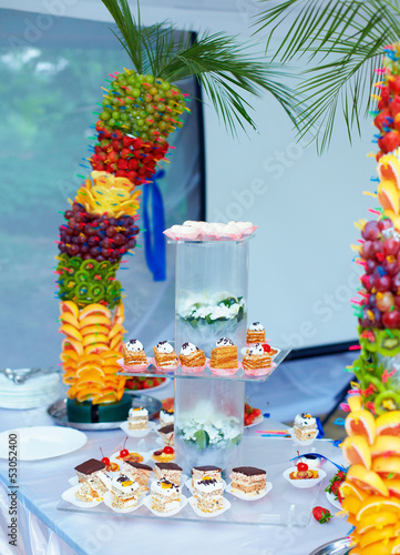 Photo: colorful fruit and cake decoration on banquet party colorful fruit and cake decoration on banquet party
