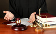 Judge sitting at table during court hearings on black