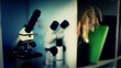 shelf with a microscope and books