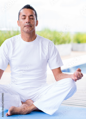 Photo: Man practicing yoga Man practicing yoga
