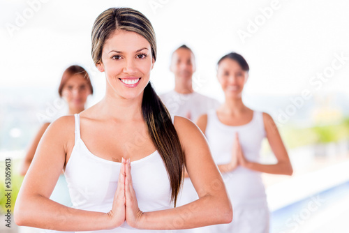 Photo: Woman in a yoga class Woman in a yoga class