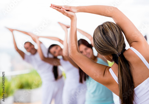 Photo: People doing yoga People doing yoga