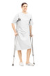 Full length portrait of a smiling male patient in hospital gown