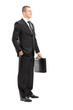 Full length portrait of a young businessman with briefcase posin