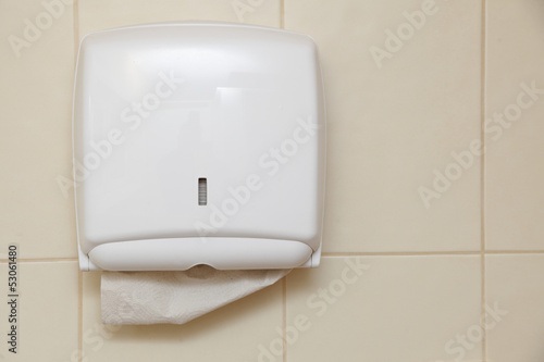 Photo: Paper towel dispenser in the bathroom Paper towel dispenser in the bathroom