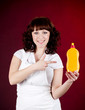 Young happy housewife cleaning dishes