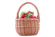 wicker basket with strawberries isolated on white