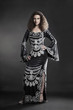 Foto: Fashion woman in elegant evening dress. Fashion woman in elegant evening dress.