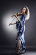 Foto: Music performer woman with violin Music performer woman with violin